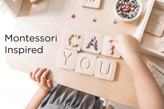 Child spelling words with the Montessori Wooden Alphabet Tracing Boards